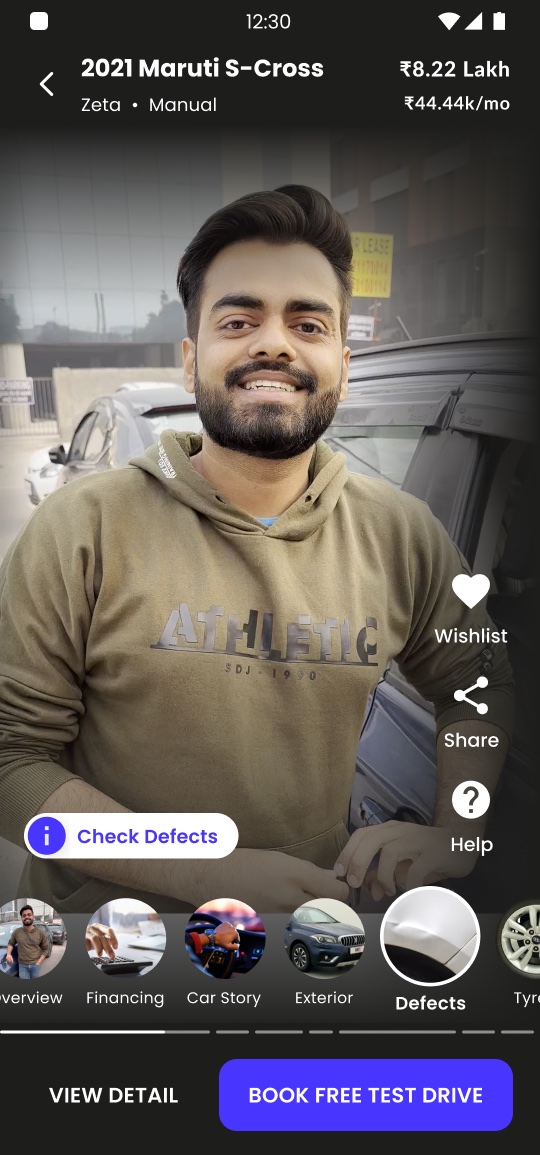 Cars24 video-first detail page for a 2021 Maruti S-Cross, with a guided video, Check Defects and a jump-to-section rail