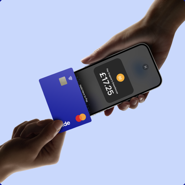 A customer tapping a card to pay on a Tide member's iPhone